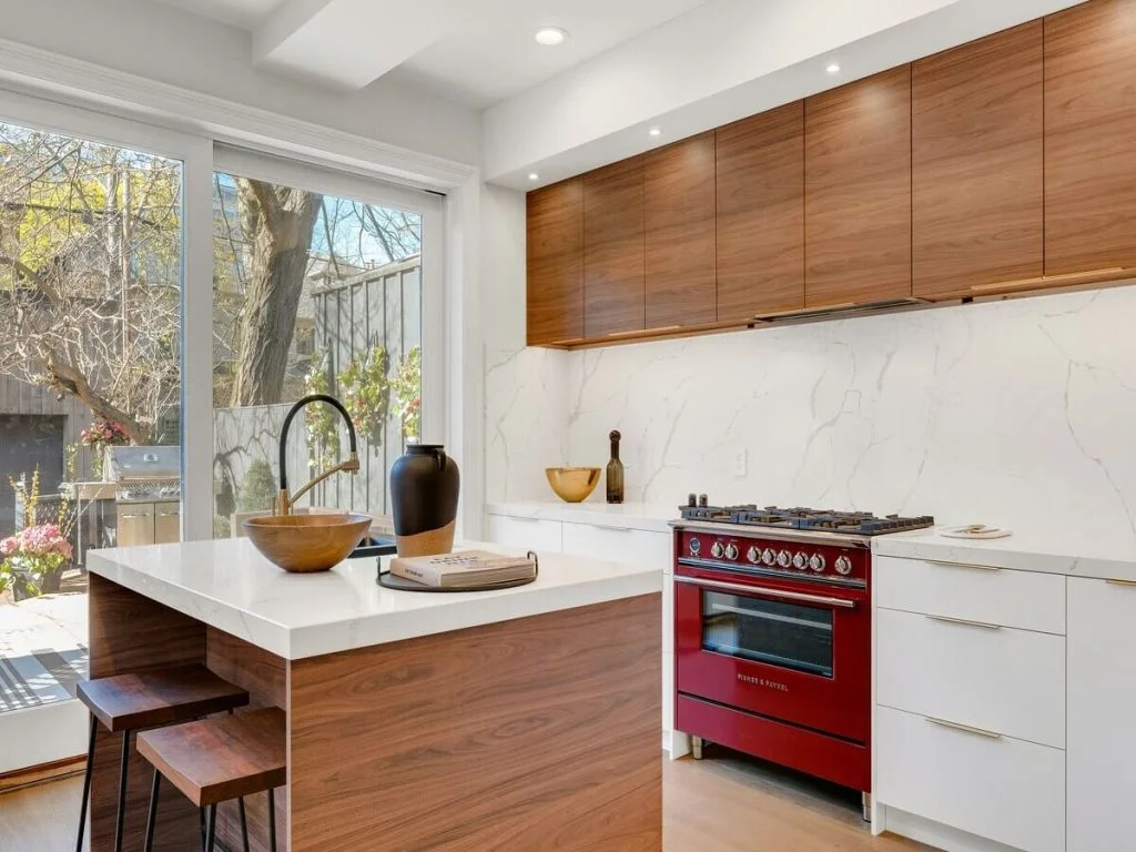 Modern kitchen with granite countertops and a stone backsplash