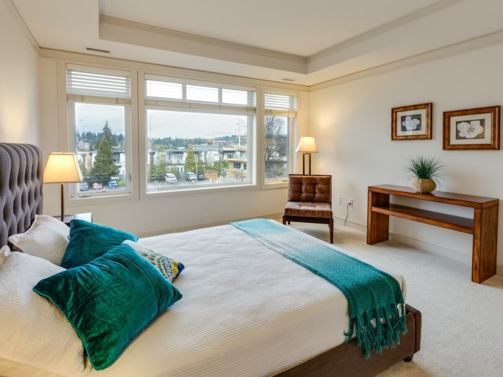 A Teal Small Master Bedroom with Big Windows