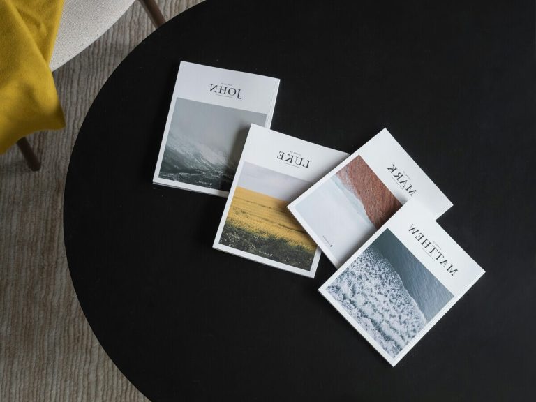 A sleek black coffee table adorned with modern books