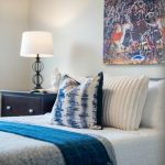 small bedroom with queen bed and slim nightstands