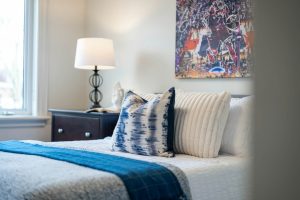 small bedroom with queen bed and slim nightstands