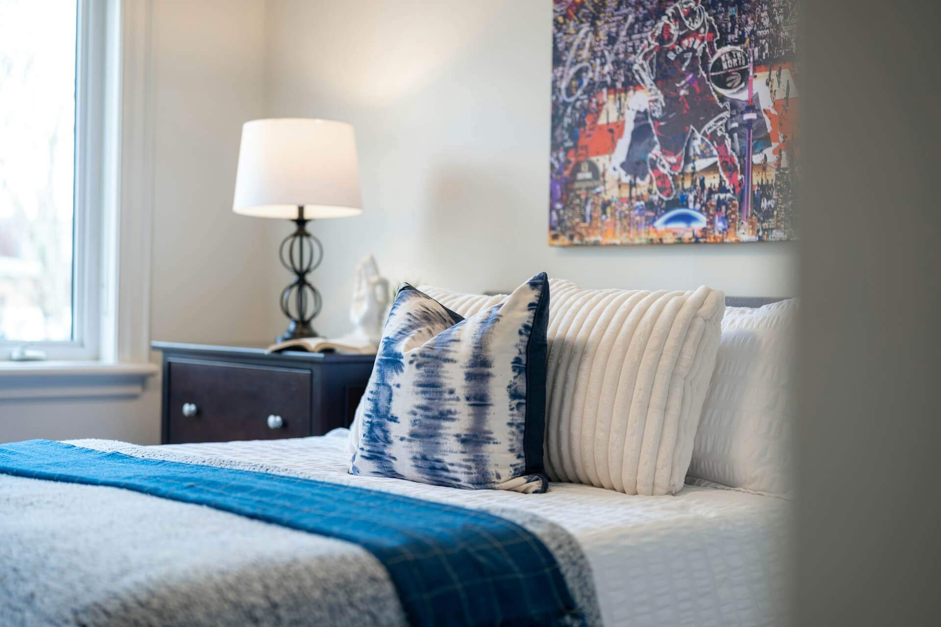 small bedroom with queen bed and slim nightstands