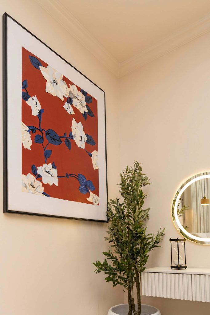 A modern bedroom with botanical olive tree with a beige walls by McFollis